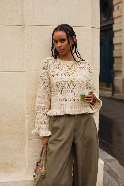 Beige knitted sweater in boho style