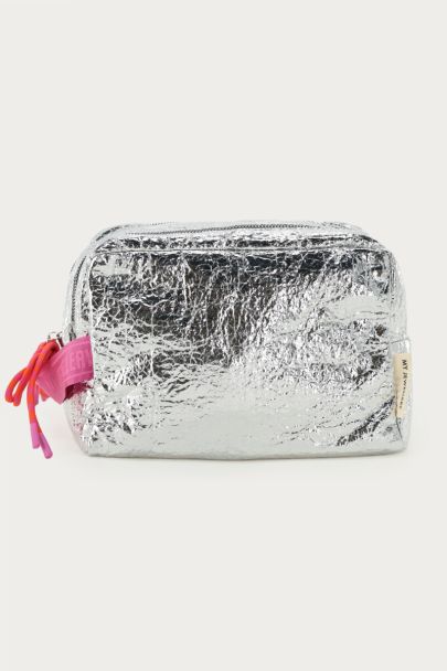 Silver-coloured toiletry bag with pink bow