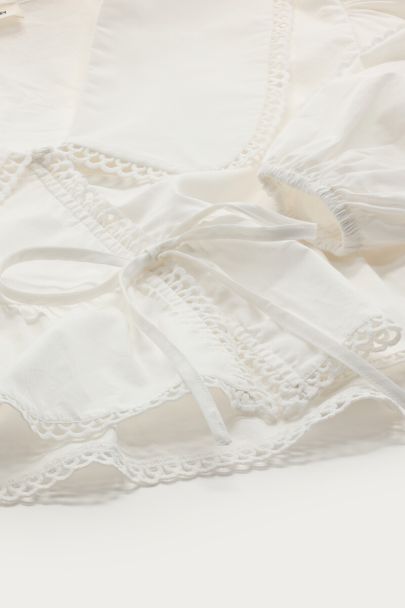 Witte blouse met peplum & strik