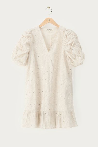 White dress with short puff sleeves and embroidery