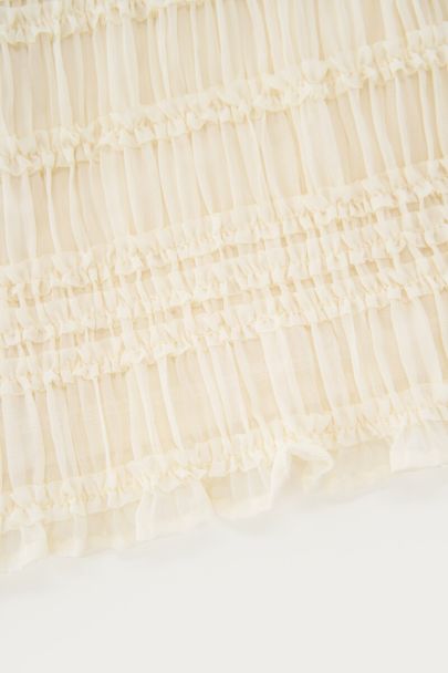 Witte haltertop met ruffles