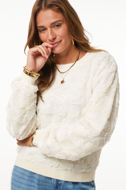 White knitted sweater with lace flowers