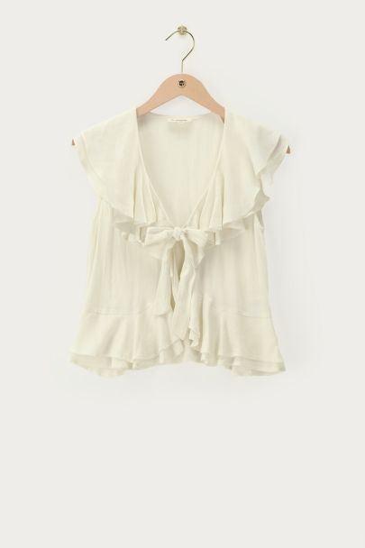 White ruffle top with bow
