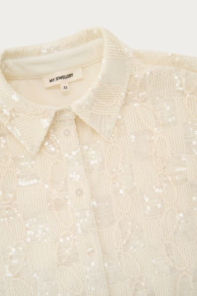 Witte blouse met korte mouwen en pailletten