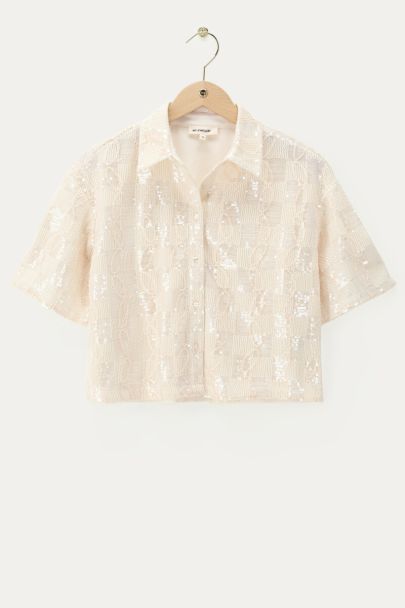 Witte blouse met korte mouwen en pailletten