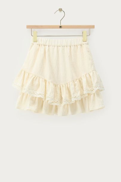 Jupe blanche avec détails en dentelle et volants