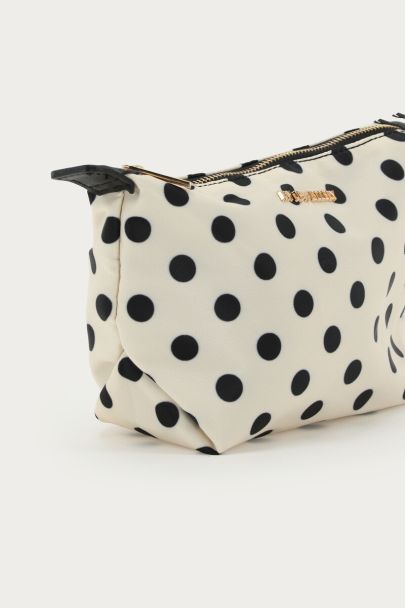 White small toiletry bag with polka dot