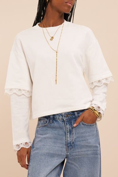 White sweater with double sleeves and lace details