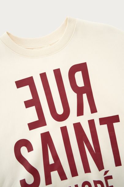 White sweatshirt with red print "Rue saint honore"