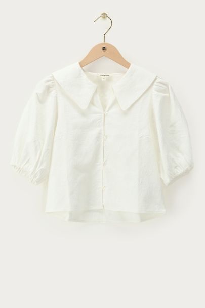 Witte top met pofmouwen en rozen details
