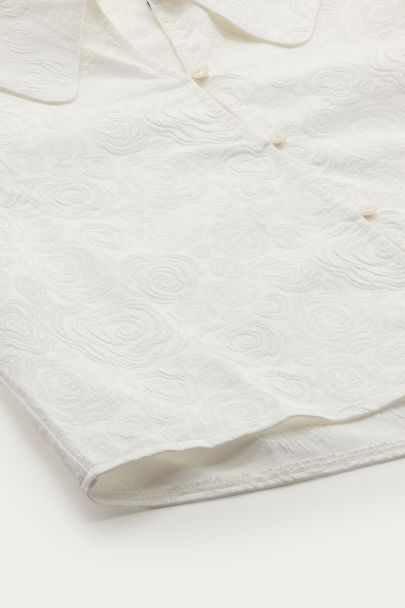 Witte top met pofmouwen en rozen details