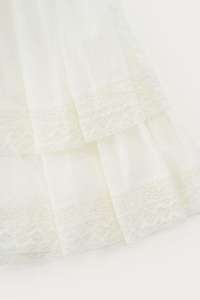 Witte wikkeljurk met ruffles
