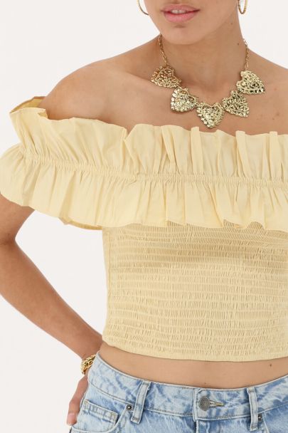 Gele gesmokte top met ruffles