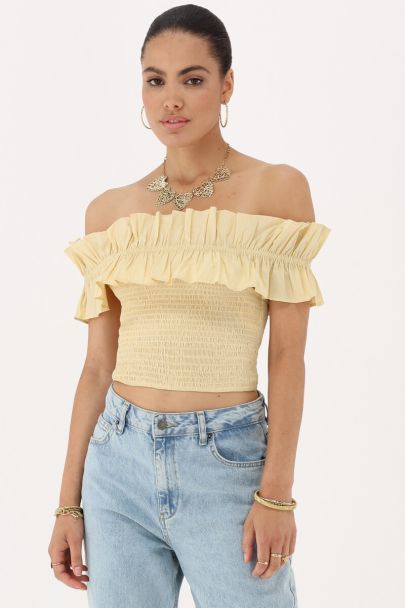 Gele gesmokte top met ruffles
