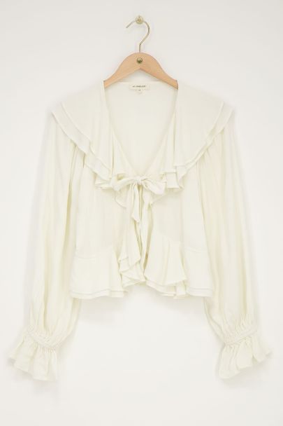 White ruffle blouse with bow