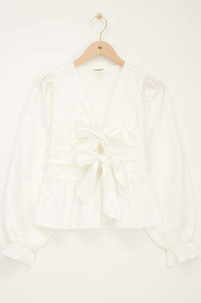 White top with bows & peplum