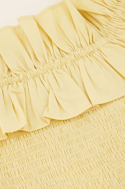Top jaune à smocks et volants