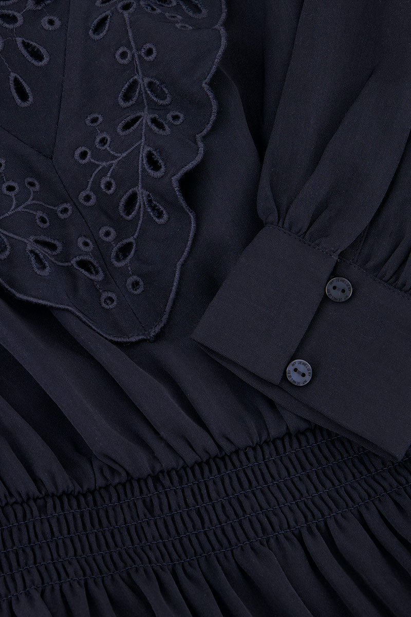 Dark blue dress with embroidery and ruffles