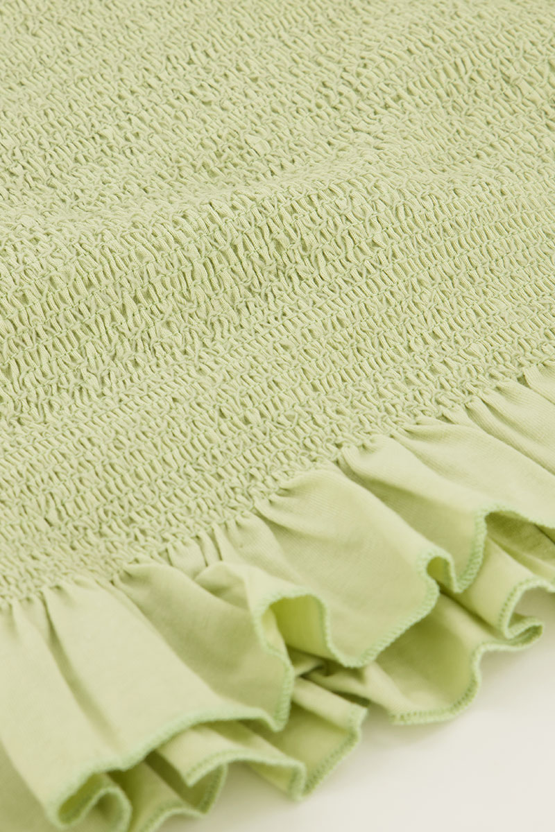 Light green smock top with ruffles