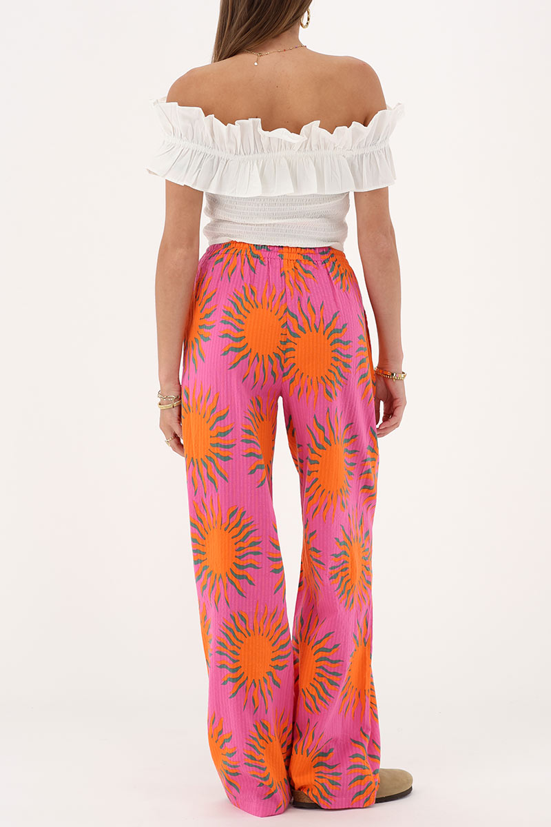 Pink wide leg trousers with sun print | My Jewellery