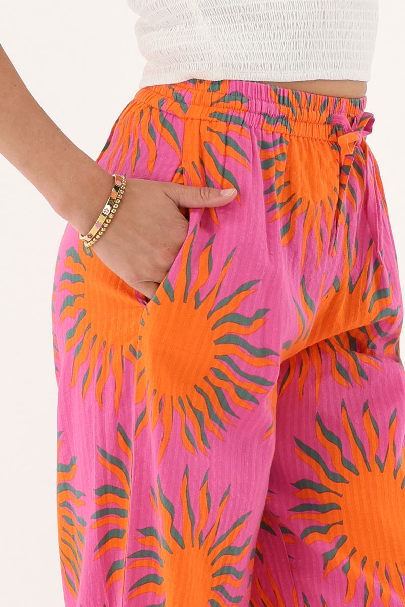Pink wide leg trousers with sun print | My Jewellery