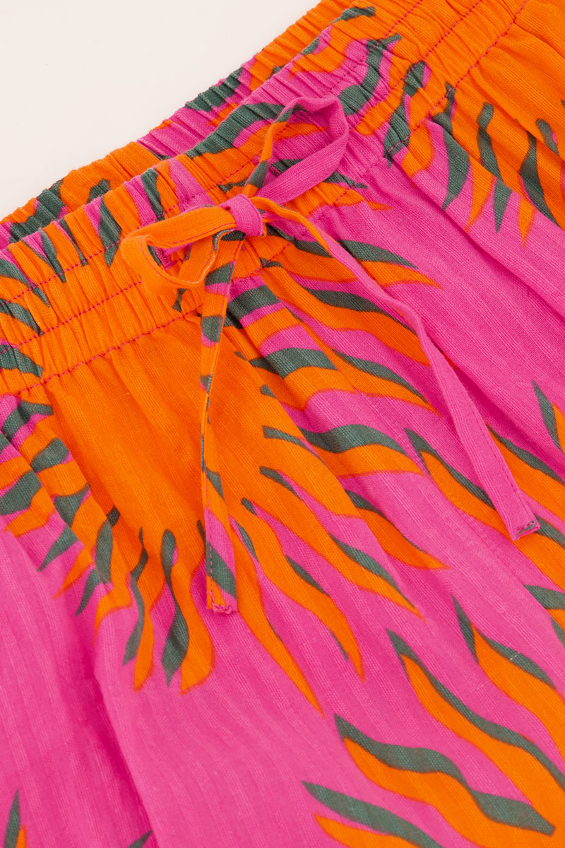 Pink wide leg trousers with sun print | My Jewellery