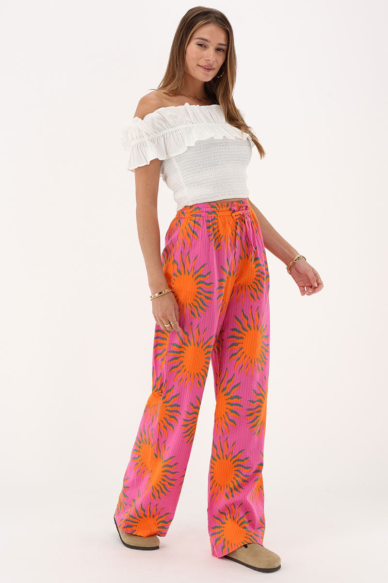 Pink wide leg trousers with sun print | My Jewellery