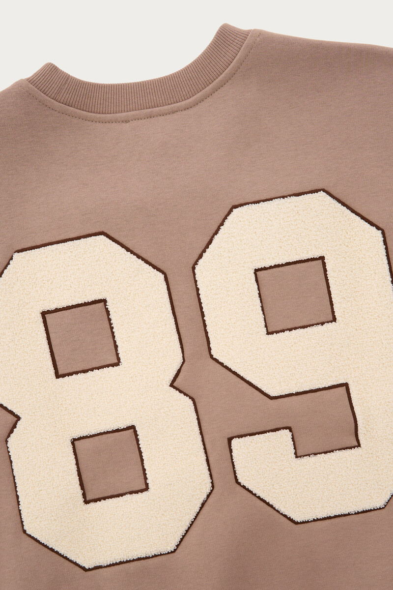 Beige sweatshirt with teddy patch | My Jewellery