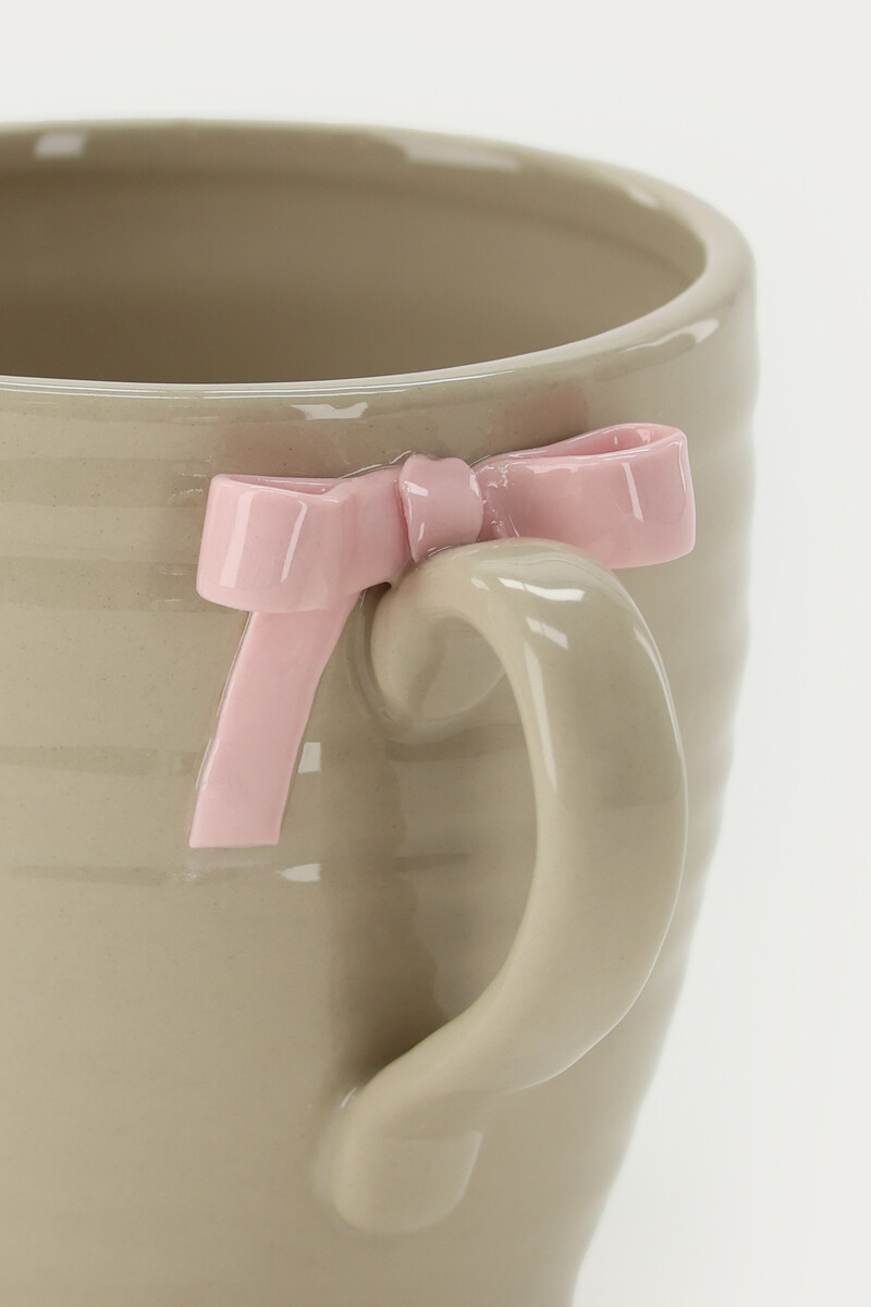Beige tea cup with bow | My Jewellery