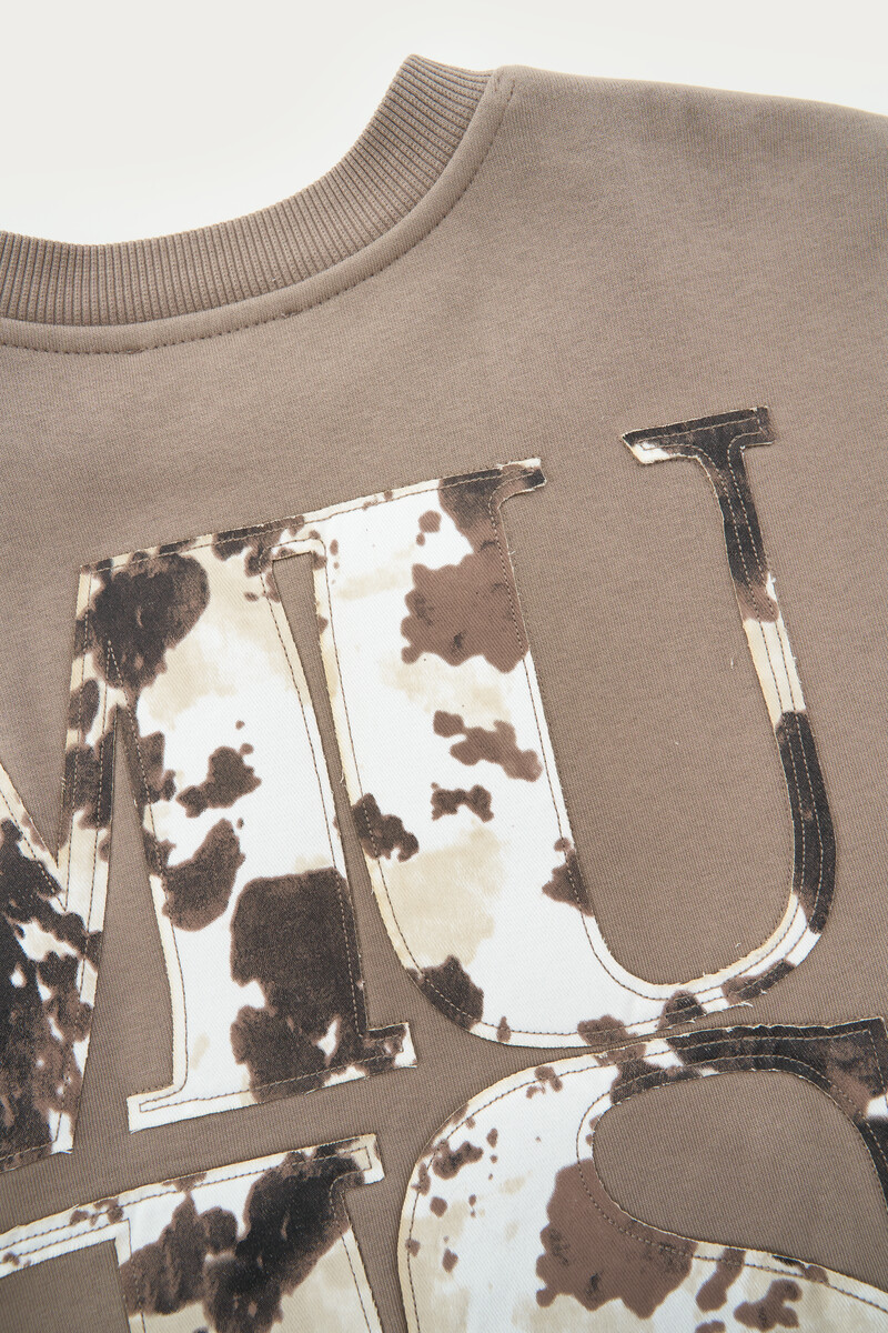 Brown sweatshirt with cow print “Muse” patch | My Jewellery