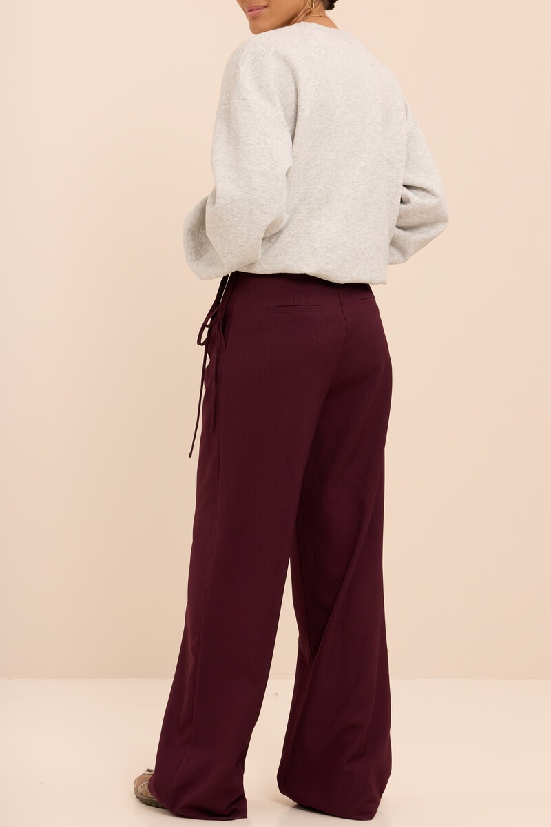 Burgundy wide leg trousers with wrap and bow | My Jewellery