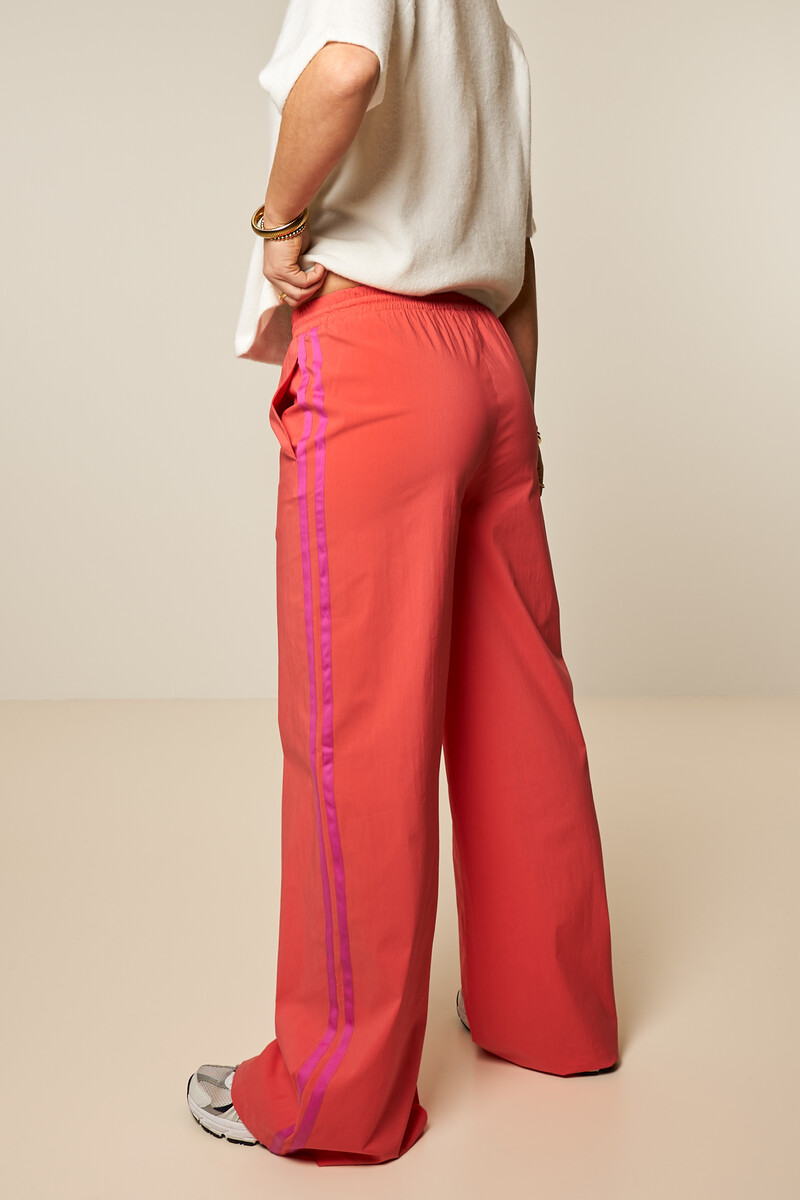 Coral wide leg trousers with contrast stripe | My Jewellery