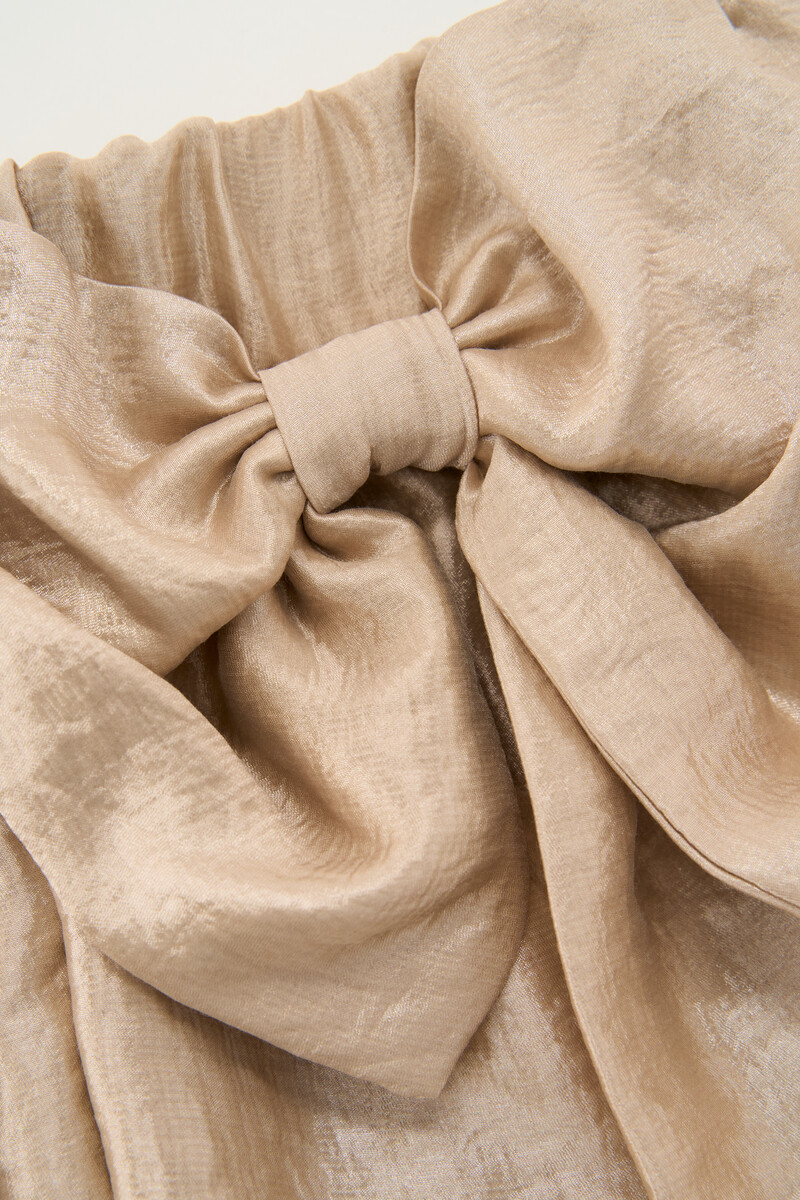 Gold coloured skirt with large bow | My Jewellery