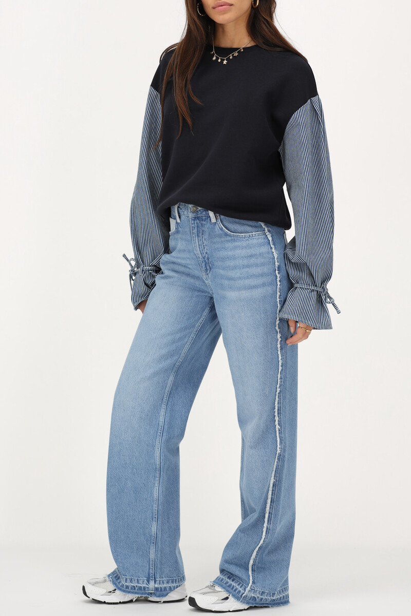 Light blue wide leg jeans with contrasting pocket | My Jewellery