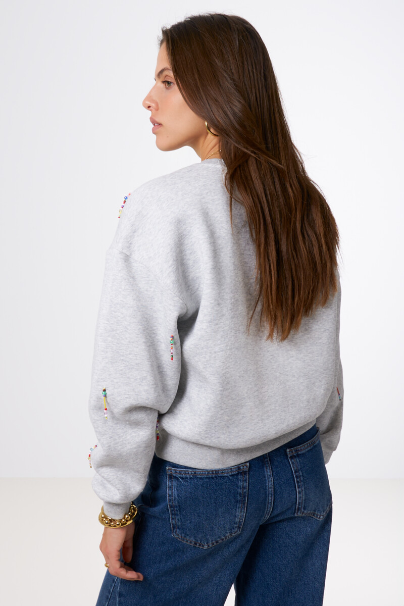 Light grey sweater with coloured beaded fringes | My Jewellery