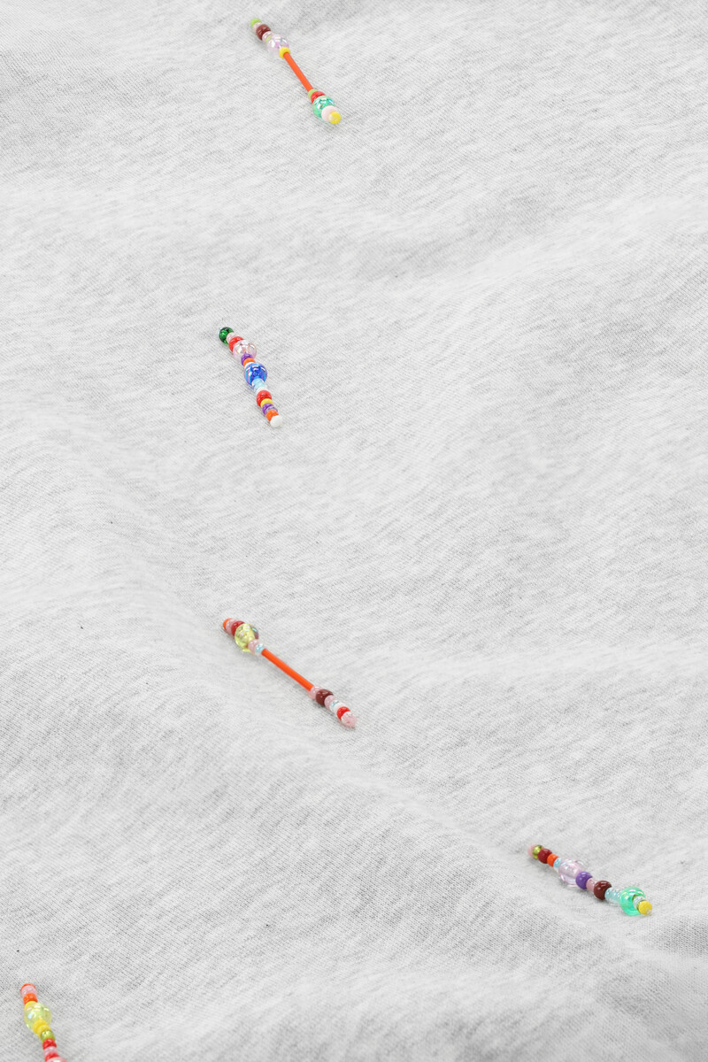 Light grey sweater with coloured beaded fringes | My Jewellery