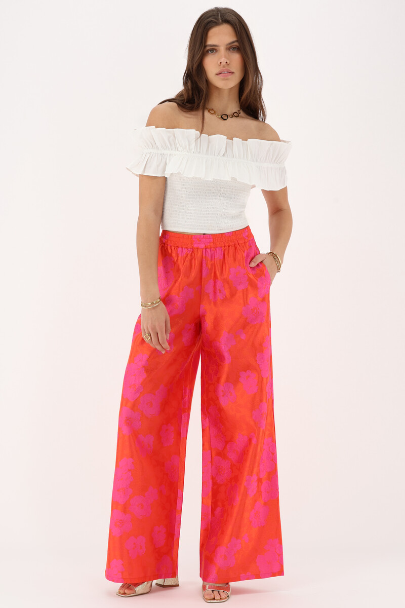 Orange jacquard wide leg trousers with pink flowers | My Jewellery