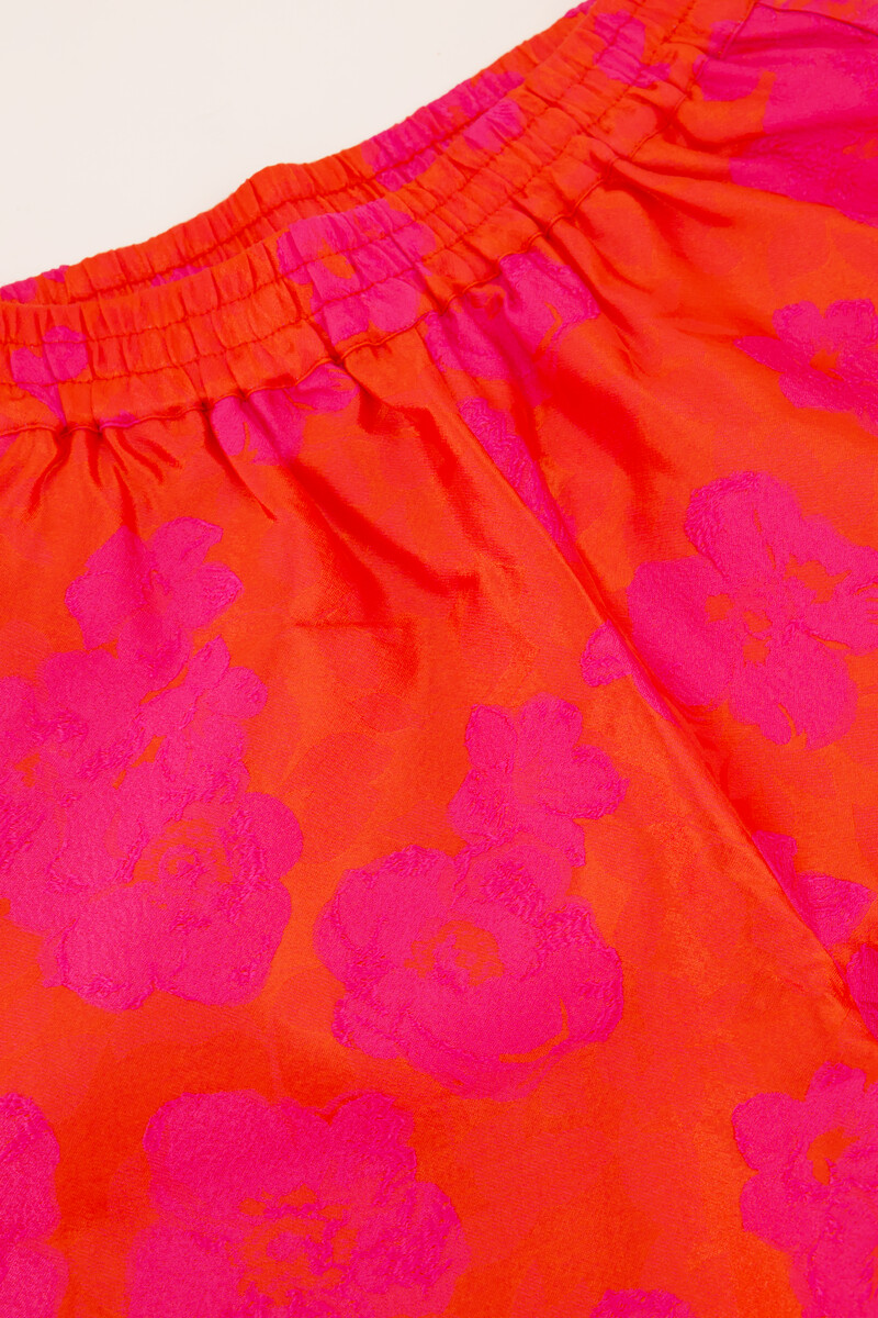 Orange jacquard wide leg trousers with pink flowers | My Jewellery