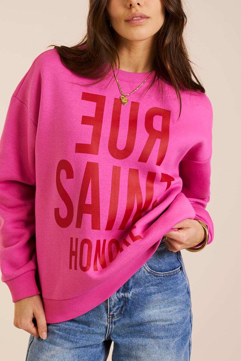 Roze sweater met rode opdruk "Rue saint honore"