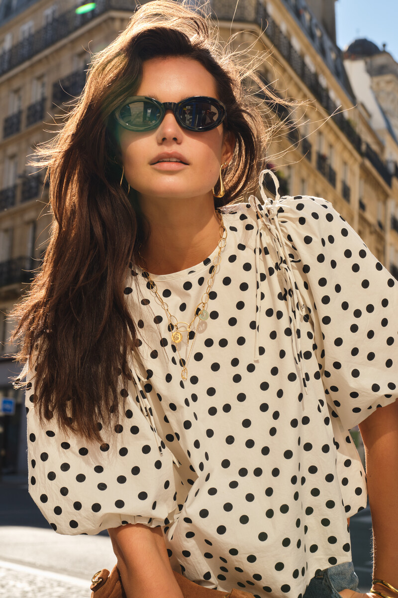 Black and white polka dot balloon top with bows and puff sleeves