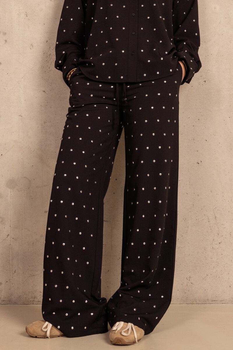 Black trousers with silver-coloured studs | My Jewellery