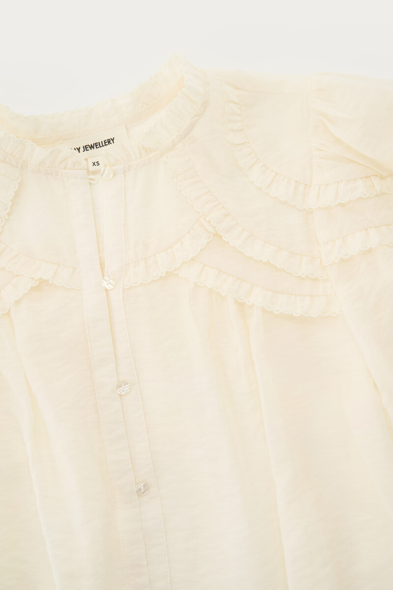 White blouse with ruffle details | My Jewellery