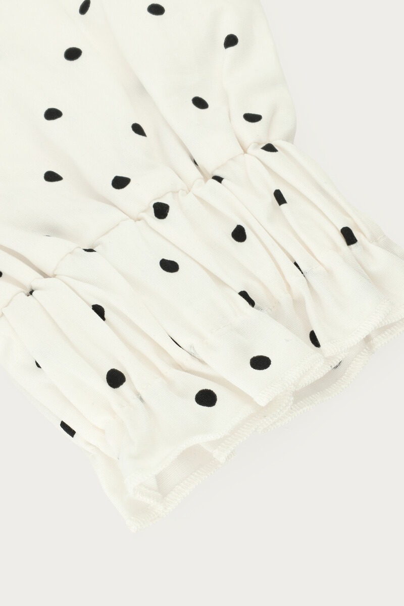 White cuffs with black polka dots | My Jewellery