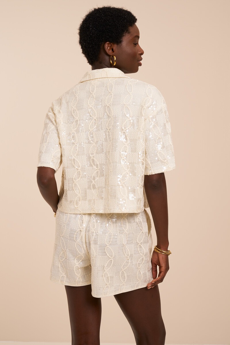 White blouse with short sleeves and sequins