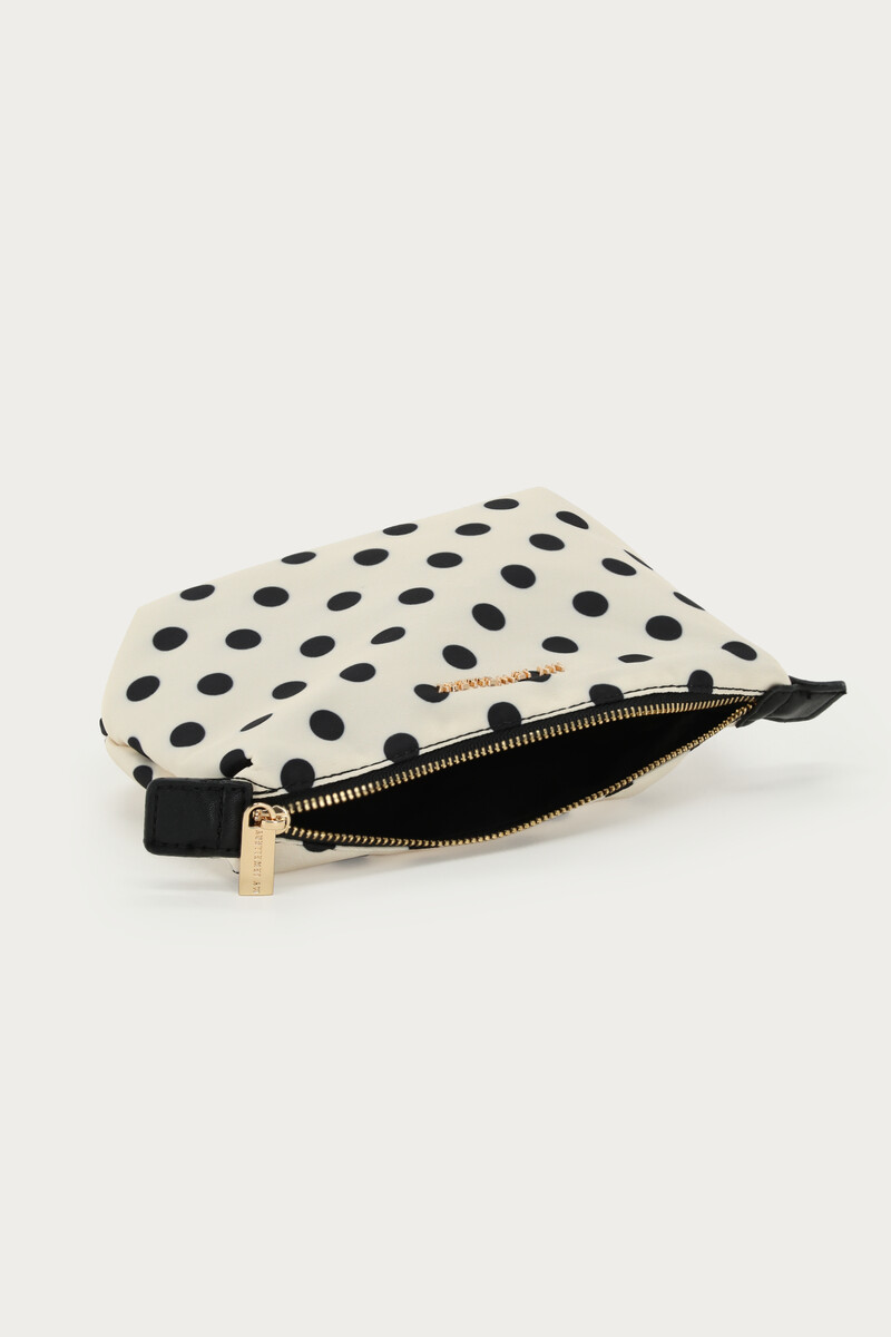 White small toiletry bag with polka dot