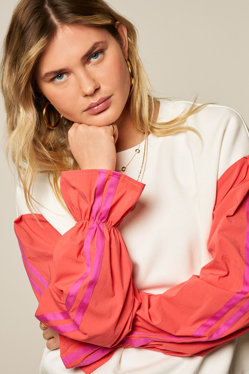 White sweater with coral contrast sleeves | My Jewellery
