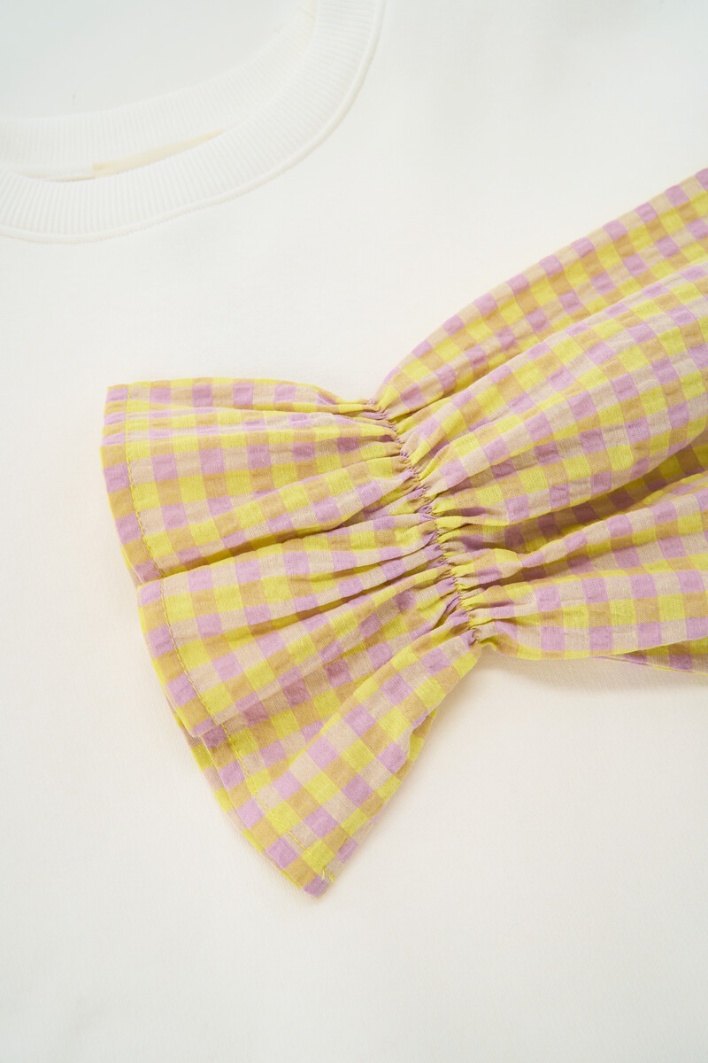 White sweater with yellow checkered sleeves | My Jewellery