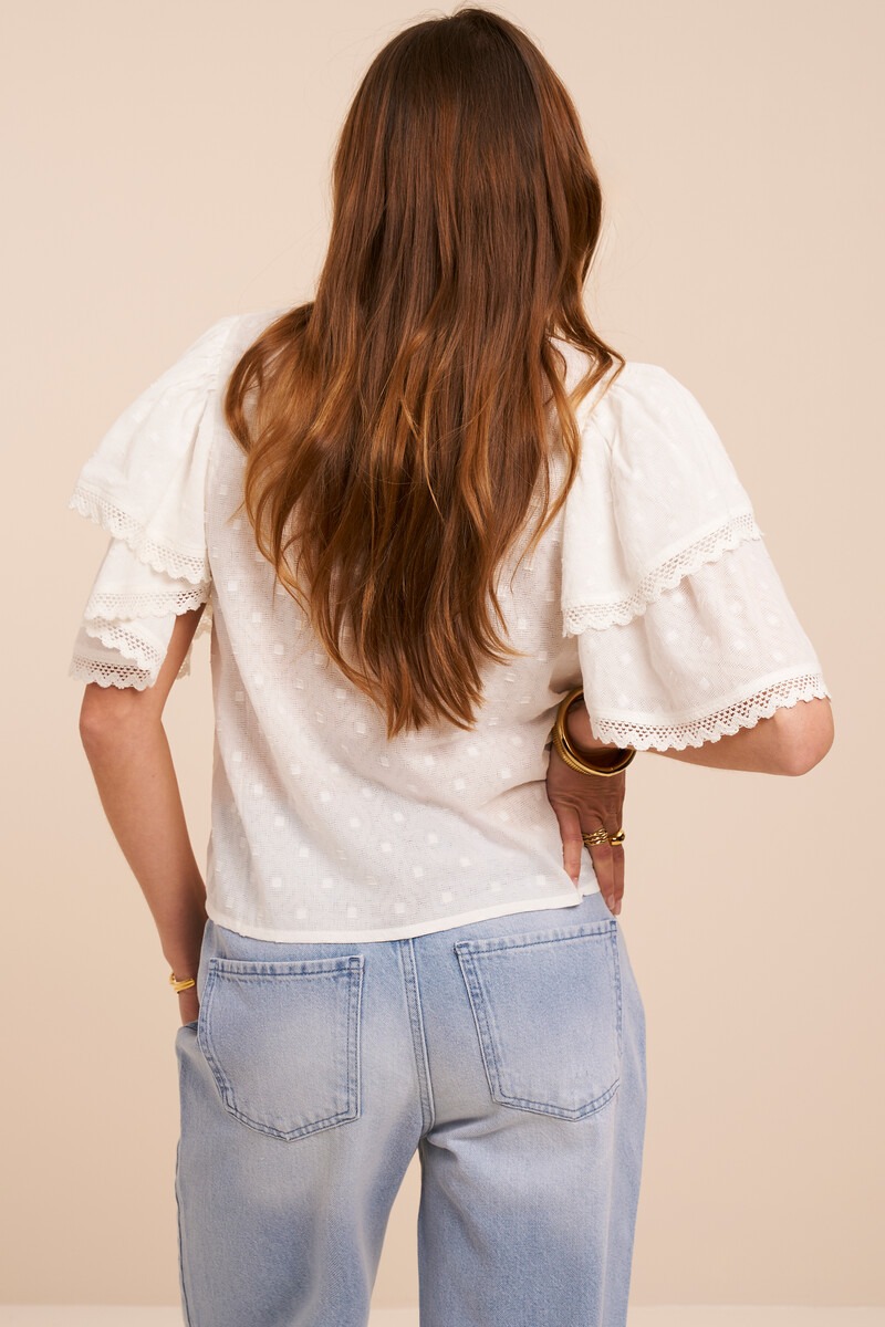 White top with short sleeves and double ruffles
