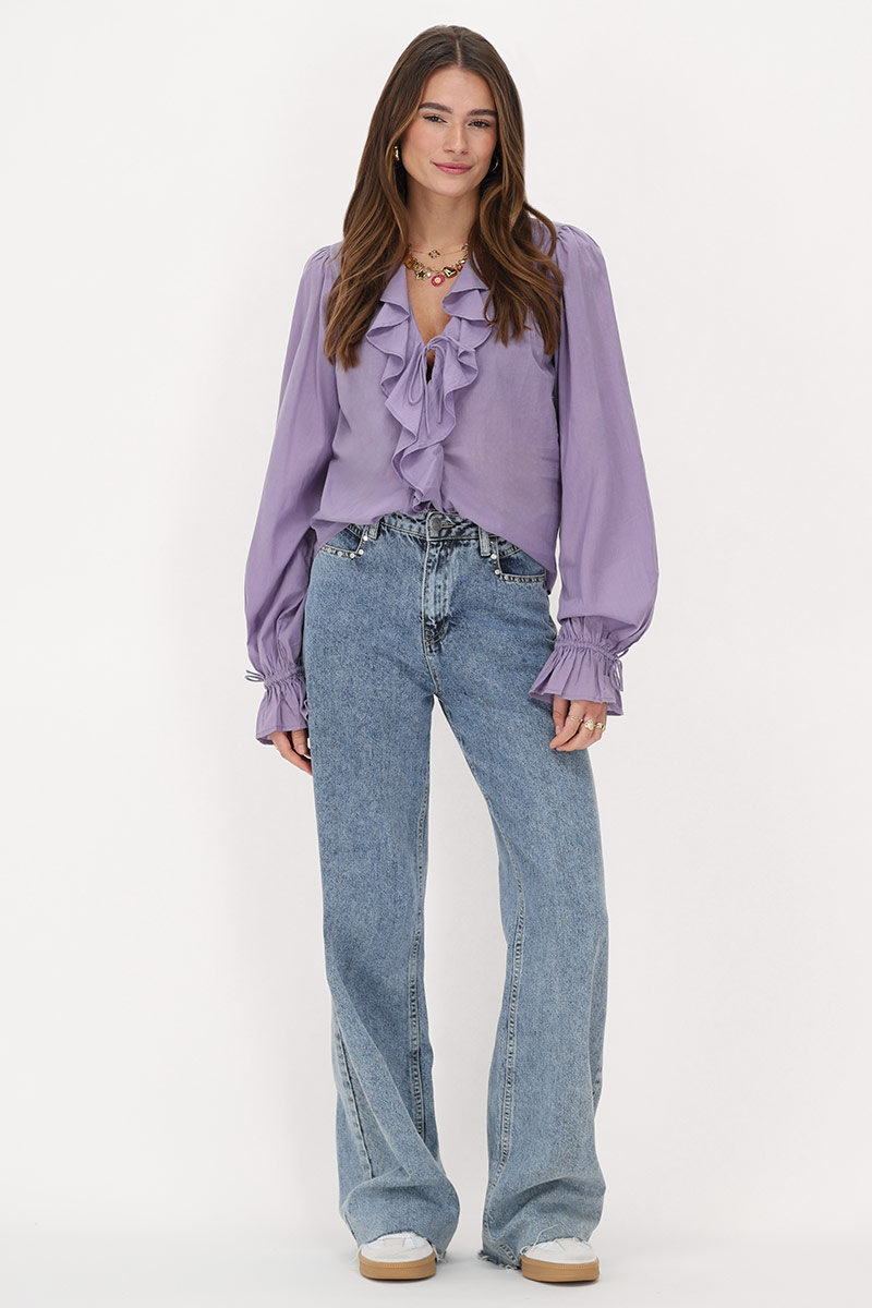 Purple blouse with ruffles and bows