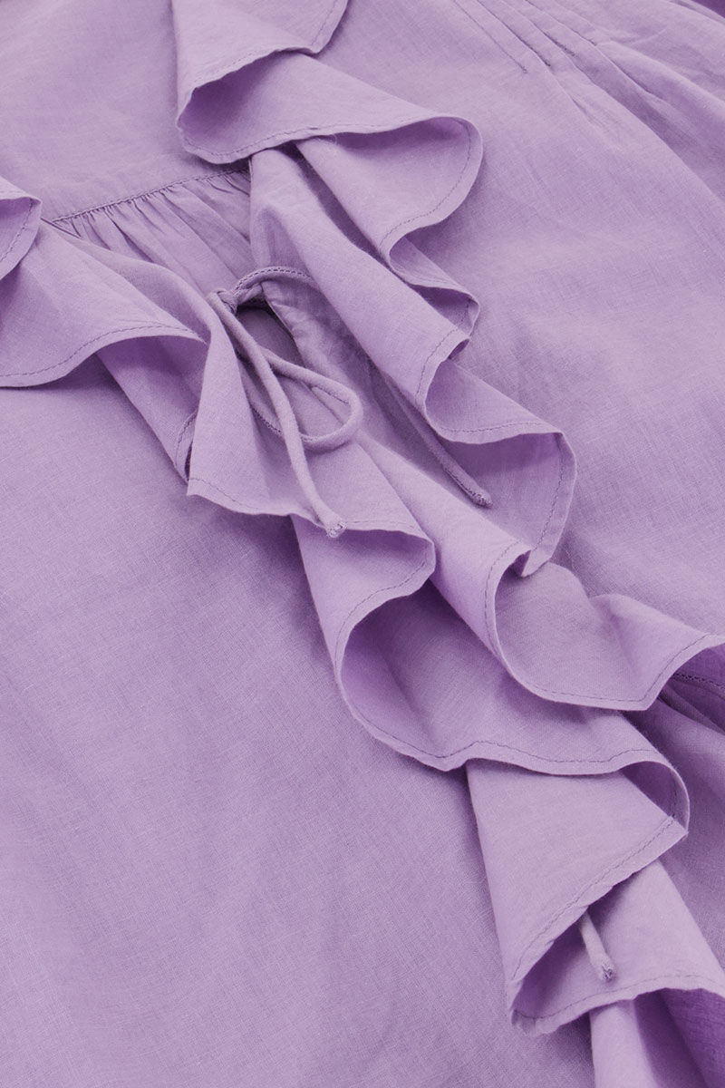 Purple blouse with ruffles and bows